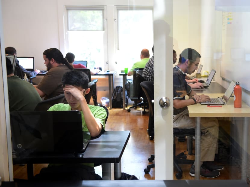 The team from Fox Networks group works at Mindspark on Aug 24, 2016 in Santa Monica, California. The firm for the past three years has employed analysts with autism to test software for companies. Photo: AFP