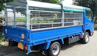 Singapore to ban caged lorries for transporting workers from 2027