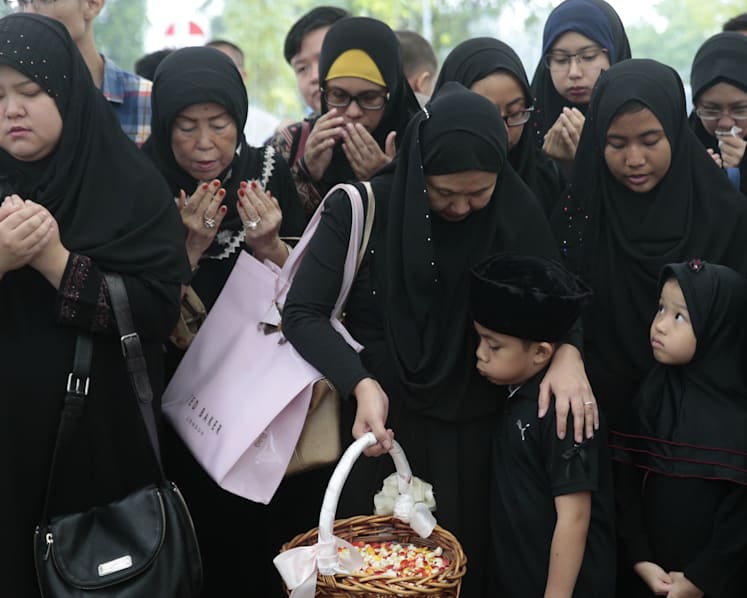 Family, friends bid final farewell to Othman Wok