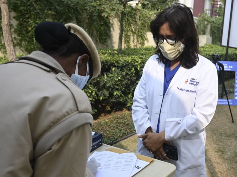 A doctor stands in a queue to get her name registered before getting a Covid-19 coronavirus vaccine at the Manipal Hospital, in New Delhi on Tuesday, Jan 19, 2021.