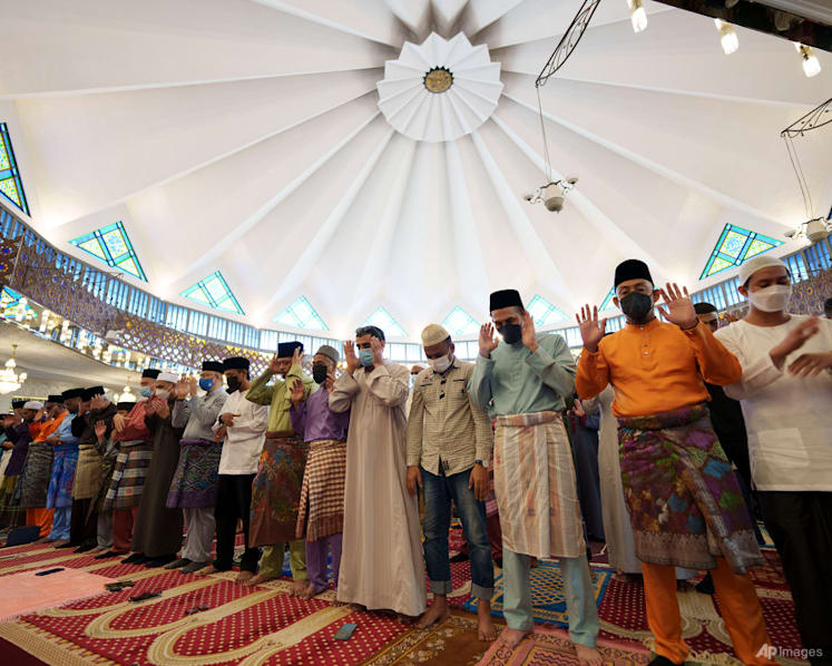 Muslims mark Eid al-Fitr holiday with joy, worry