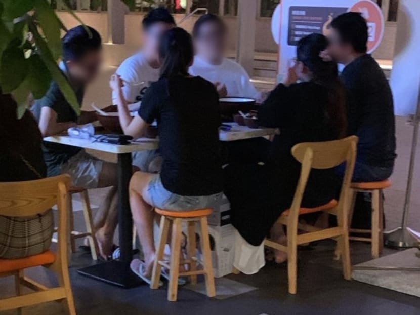 A group of six customers seated together at an F&B outlet in the Central Business District on Saturday, Sept 12, 2020. A group of six customers seated together at an F&B outlet in the Central Business District on Saturday, Sept 12, 2020.