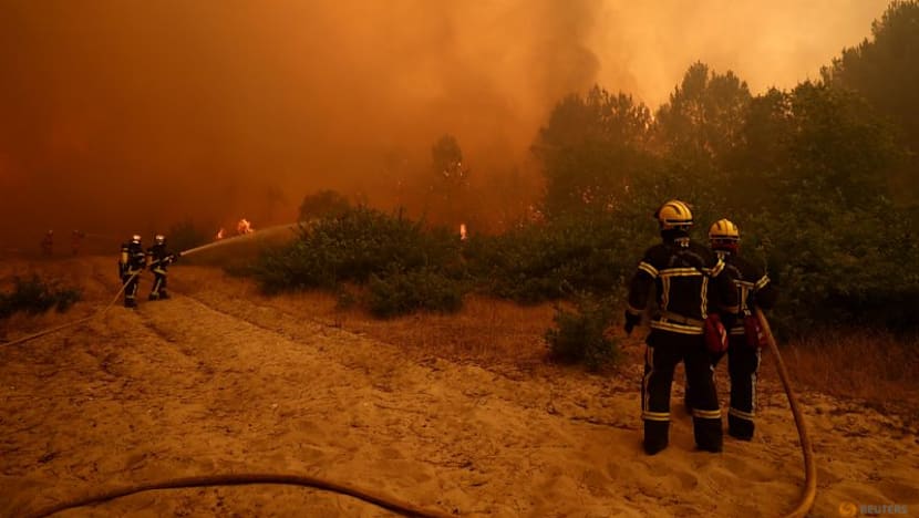 Over 100,000 flee or hole up indoors as wildfires rage in France and Spain