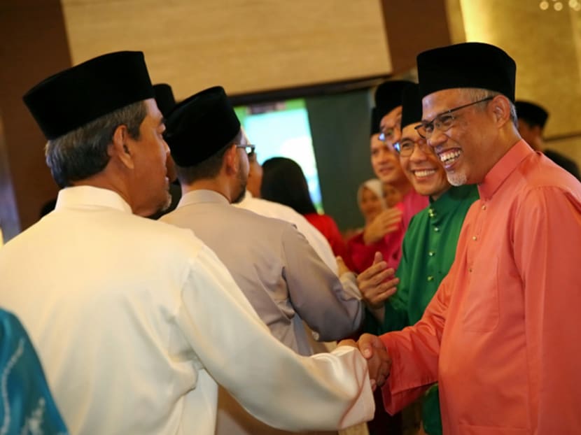 Minister-in-charge of Muslim Affairs Masagos Zulkifli (right) highlighted the strong performance of Malay-Muslim students in the Pisa global ranking as evidence of the success of the community.