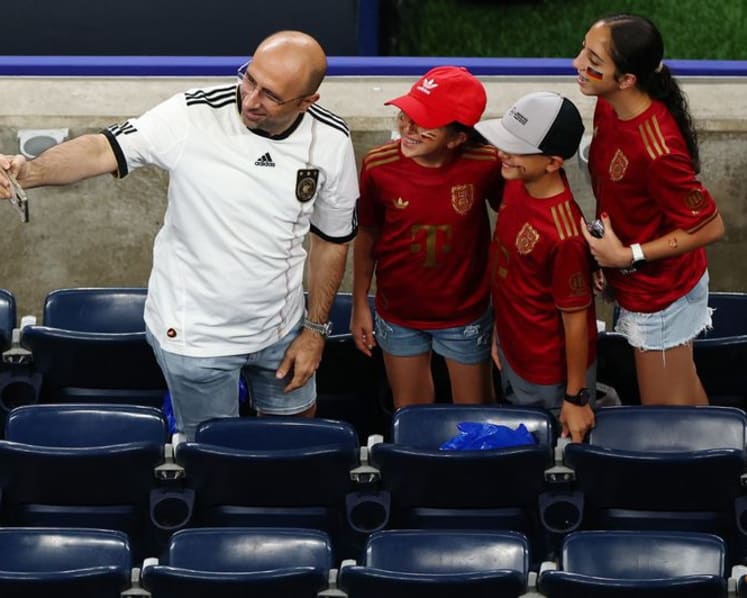 Rain sends Germany and Curacao fans on pre-match hunt for umbrellas and beer