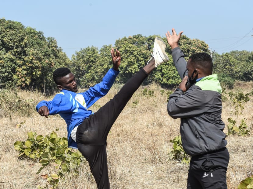 Izamam Majgul (left), member of the Siddi community, practises with coach Hasan Majgul during an athletes program at Jambur village, in Junagadh district of Gujarat on Jan 6, 2021.
