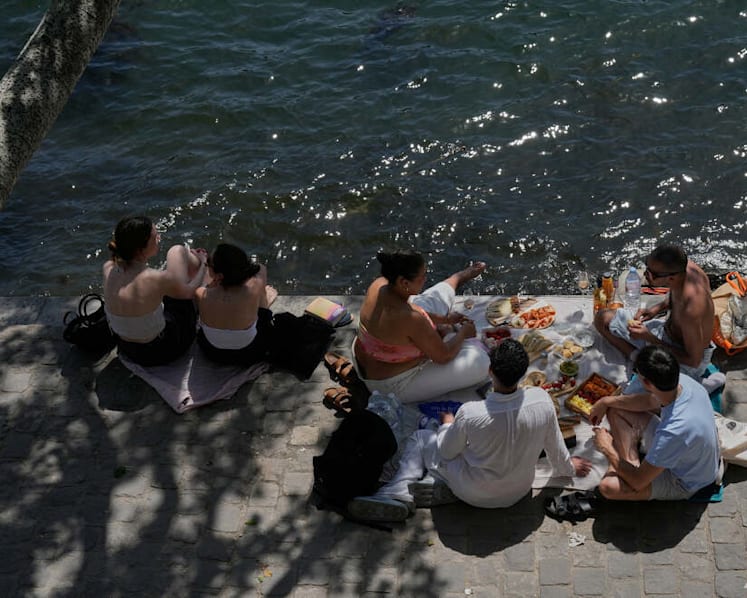 Parts of Europe swelter in record May heat as deaths at amateur sports events spur warnings