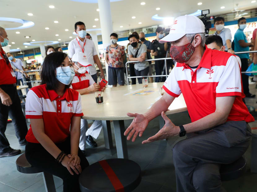 Progress Singapore Party member Lee Hsien Yang (right) speaking to fellow party member Wendy Low during a breakfast meeting at Tiong Bahru Market on June 24, 2020. Progress Singapore Party member Lee Hsien Yang (right) speaking to fellow party member Wendy Low during a breakfast meeting at Tiong Bahru Market on June 24, 2020.
