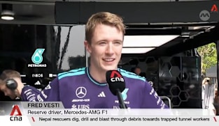 Mercedes reserve driver Fred Vesti races down Orchard Road as part of motorsport festival