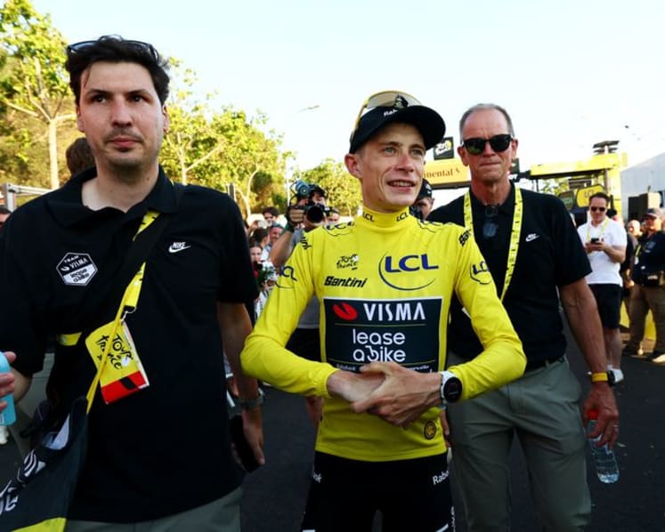 Vingegaard closes difficult chapter as he dons Tour yellow jersey