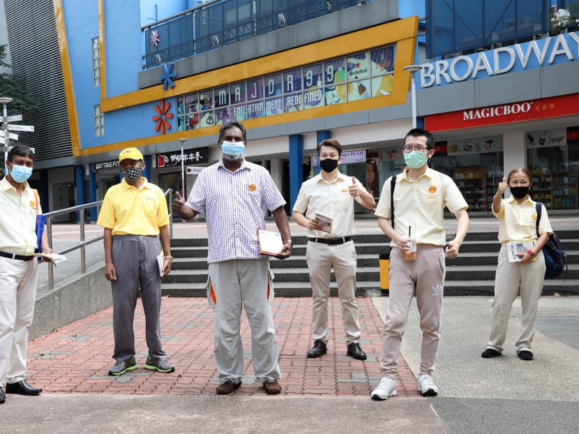 Reform Party members and volunteers during a walkabout at Ang Mo Kio Central Market and Food Centre on June 25, 2020.