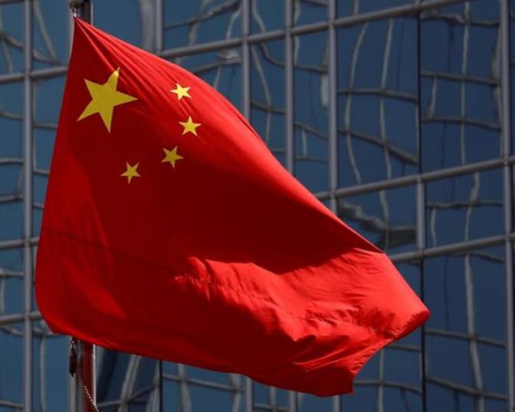 China approves amendments outlawing insulting national flag