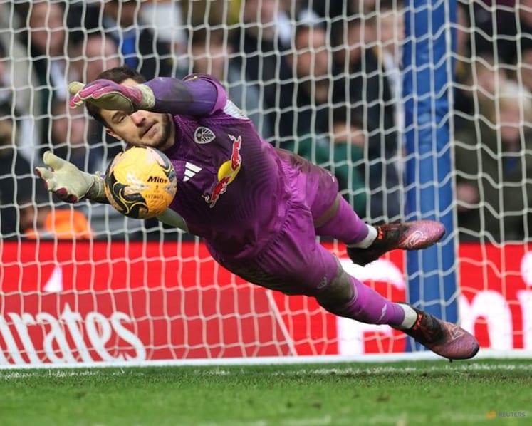 Arsenal stroll to Wigan win as Leeds beat Birmingham, Wolves survive Grimsby mud bath