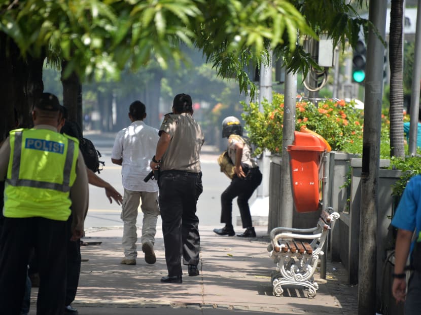 Seven dead in Jakarta blasts, gunfight