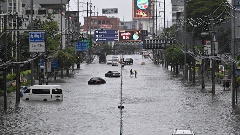 Heavy rain and flooding in Bangkok disrupts traffic and prompts evacuations