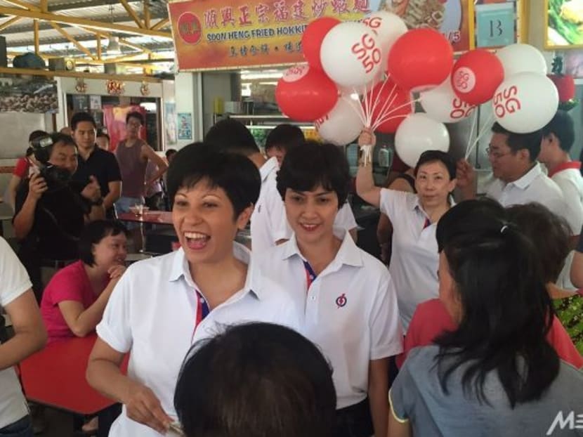 Joan Pereira (centre) on a walkabout with Tanjong Pagar GRC MP Indranee Rajah. Photo: Imelda Saad