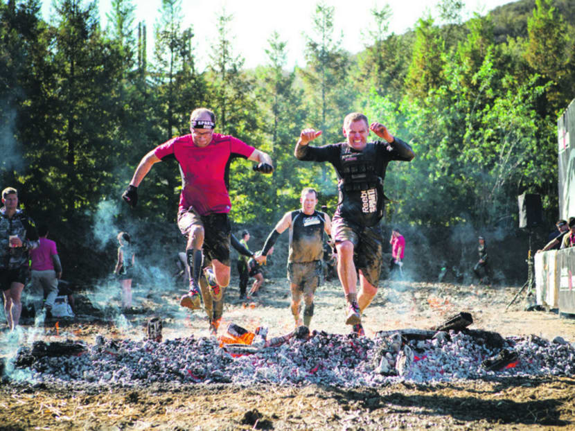 Joe DeSena tackling the obstacles at the Spartan Race.
