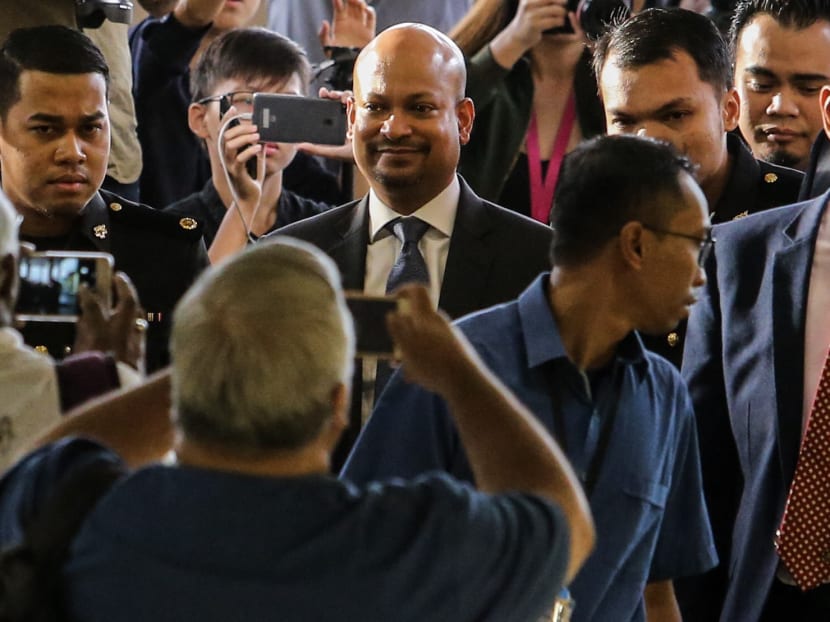 Former 1MDB chief executive officer Arul Kanda Kandasamy (centre) arrives at the Kuala Lumpur Sessions Court.