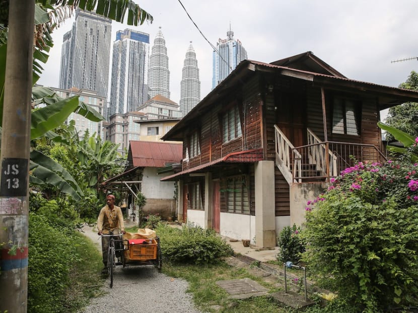 Bucolic scenes like this one are still commonplace in Kampung Baru.