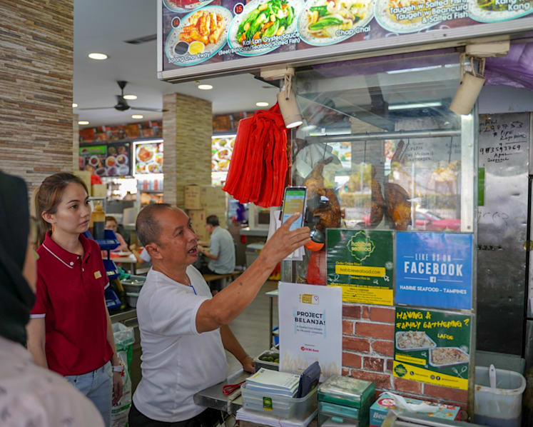 Order, scan, eat: Seniors-in-need go high-tech to claim daily hot meals from food stalls