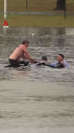 Australian TV reporter saves man from sinking car in floodwaters