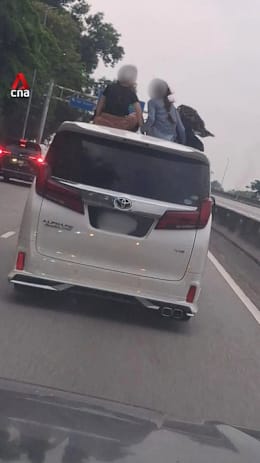 Malaysian police investigating video of 2 children sitting on roof of moving vehicle