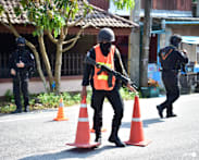 Dozens of attacks in Thailand's restive south leave 2 injured