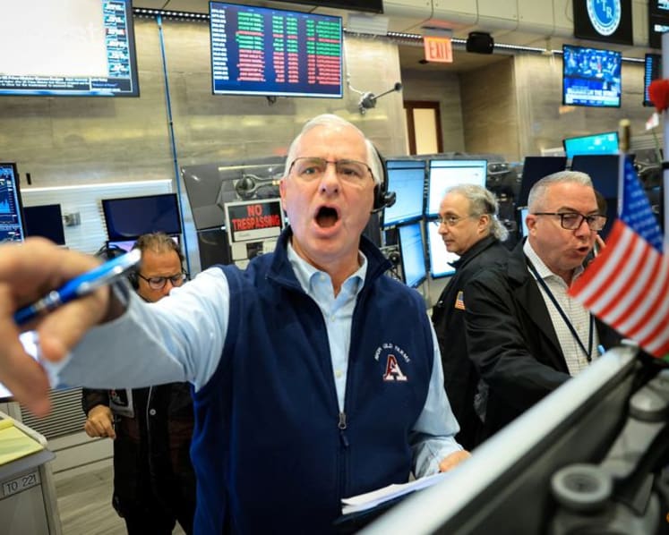 Stocks surge on chip news, oil holds at pre-war levels