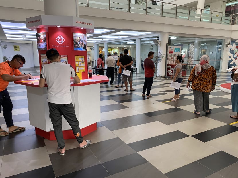 People queuing to apply for the Temporary Relief Fund at Nanyang Community Club in Jurong West when applications opened on April 1, 2020.