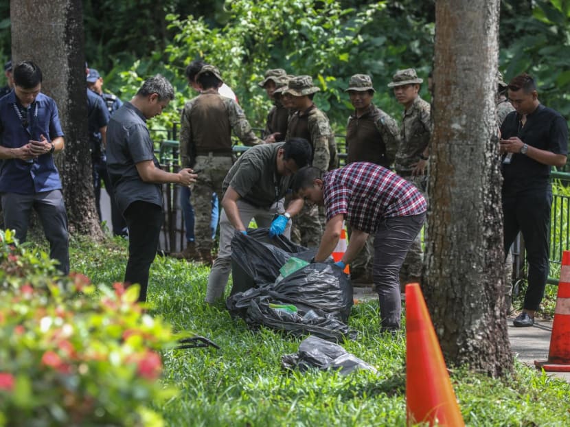 Police and workers filling trash bags with items retrieved from inside a drain along a footpath on Hume Avenue on May 25, 2023. More than 30 bags were seen filled and loaded into a waste management vehicle. 