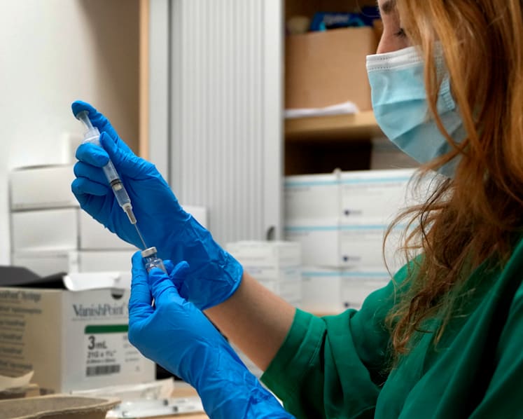 Commentary: A year of COVID-19 vaccines - how the UK pinned hopes on jabs and why some are under threat
