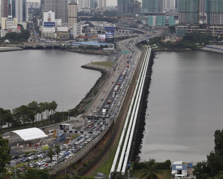 Inconsiderate drivers add to traffic congestion at checkpoints, says K Shanmugam; queue-cutting a common gripe among motorists