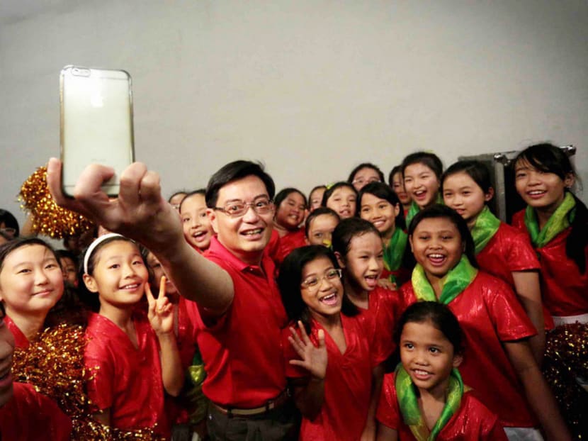 Mr Heng, who was Education Minister from 2011 to 2015, taking a selfie with participants of last year’s Youth Celebrate! event, which was held as part of the SG50 celebrations. TODAY file photo