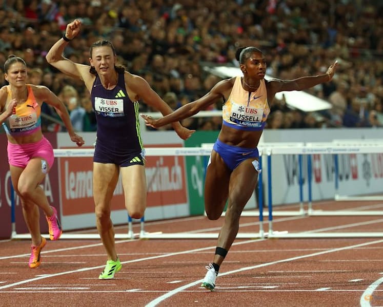 American Russell hurdles to world record in Zurich