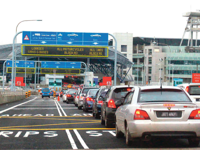 A view of the Tuas Checkpoint (pictured). Kelvin Seo Wen Quan received information on which lane to take to avoid detailed checks from customs officers. A view of the Tuas Checkpoint (pictured). Kelvin Seo Wen Quan received information on which lane to take to avoid detailed checks from customs officers.