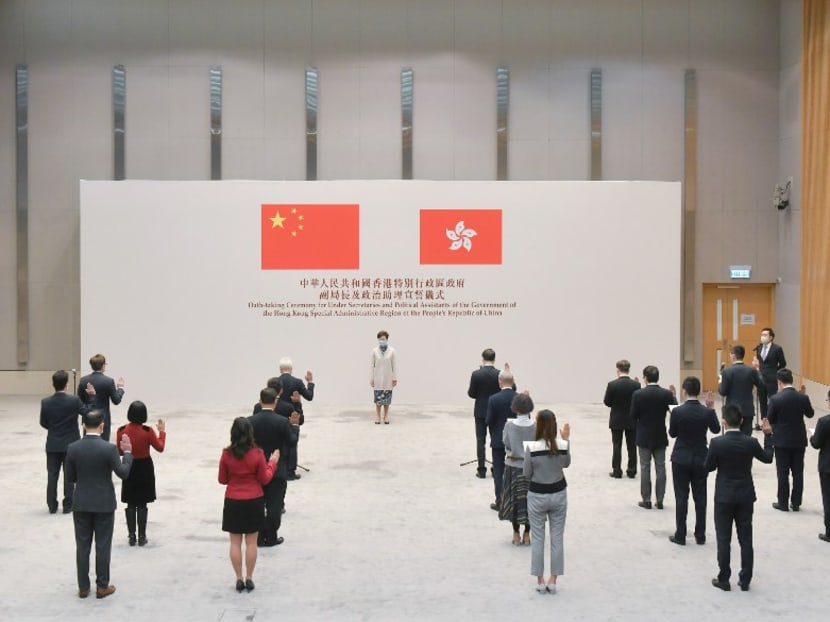 This handout photo from the Hong Kong government's Information Services Department (ISD) taken and received on Dec 16, 2020 shows Hong Kong's chief executive Carrie Lam overseeing an oath-taking ceremony for under secretaries and political assistants at the Central Government Offices in Hong Kong.
