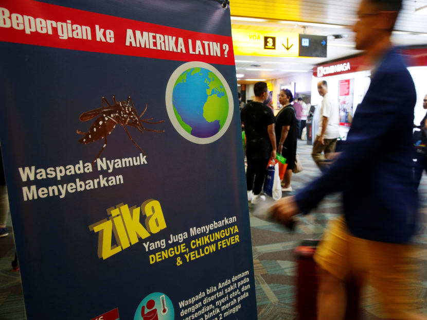 Passengers arriving from Singapore walk near a banner about Zika virus at the Soekarno-Hatta airport in Jakarta, Indonesia, on Aug 30, 2016. Photo: Reuters Passengers arriving from Singapore walk near a banner about Zika virus at the Soekarno-Hatta airport in Jakarta, Indonesia, on Aug 30, 2016. Photo: Reuters