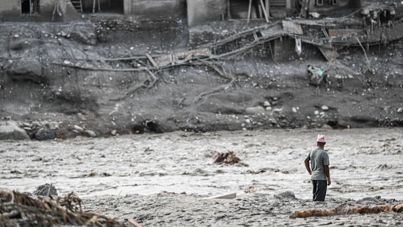 Nepal’s riverside communities cling to hope with loved ones missing after deadly flood