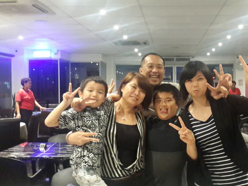 Larry and his family at Joji’s Exquisite, one of five eateries he owns. Photo: Larry Tan