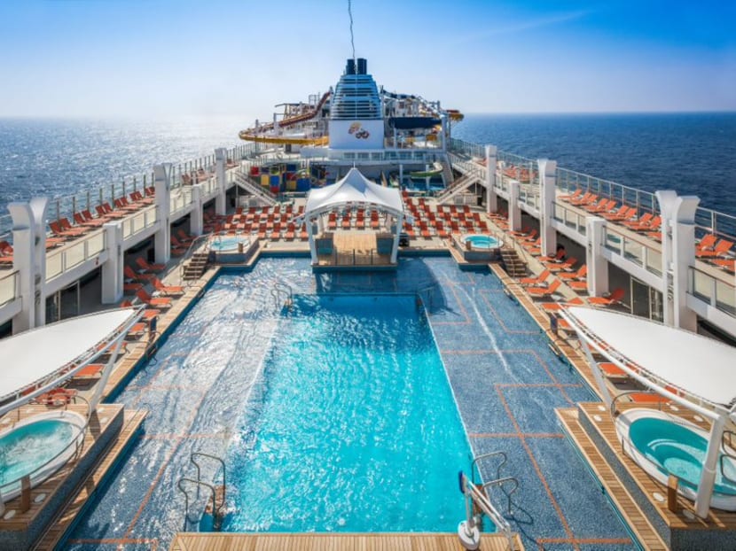 A view of the main swimming pool onboard the Genting Dream cruise liner. A view of the main swimming pool onboard the Genting Dream cruise liner.