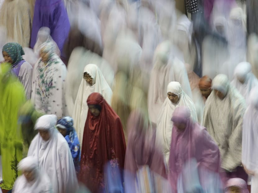 Muslim women in Indonesia offer an evening prayer. AP file photo