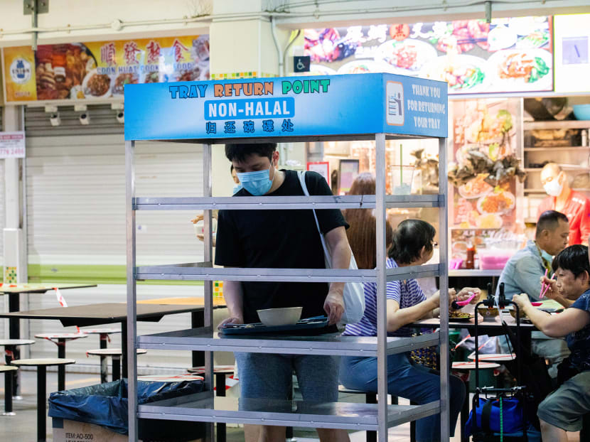 A patron returning his tray at the tray return point after having a meal at Clementi 448 Market and Food Centre on June 21, 2021. A patron returning his tray at the tray return point after having a meal at Clementi 448 Market and Food Centre on June 21, 2021.