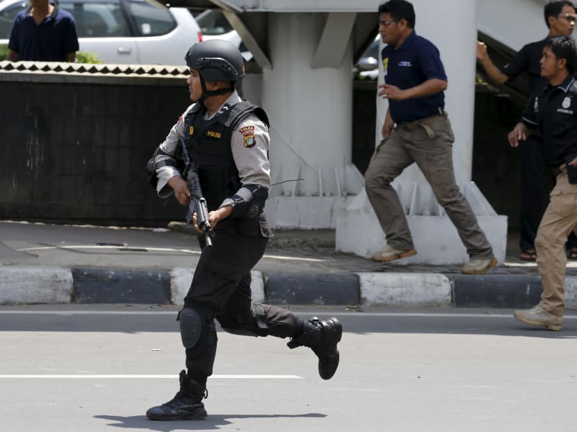 Seven dead in Jakarta blasts, gunfight