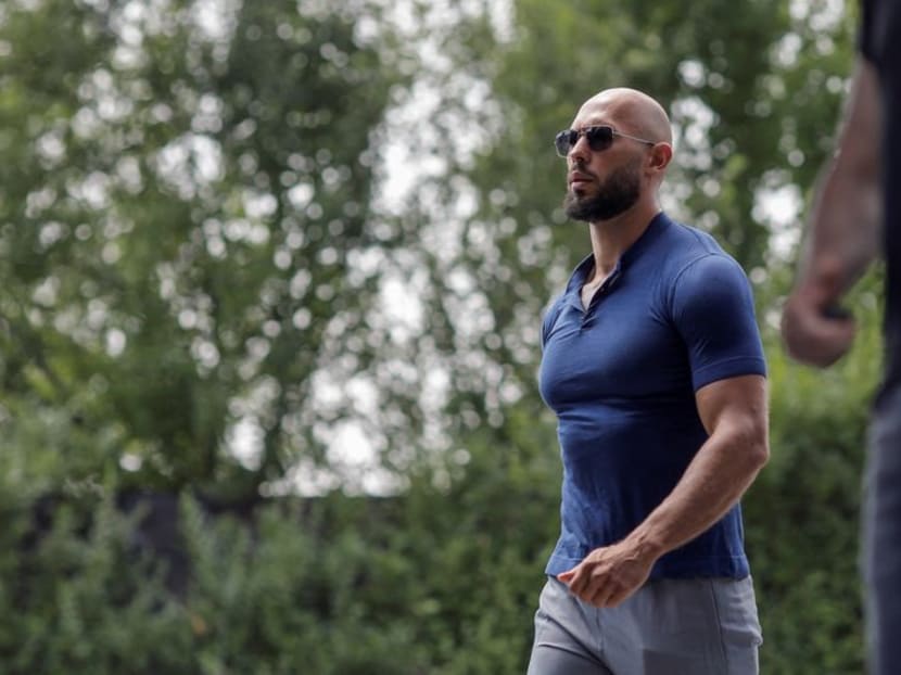 FILE PHOTO: Andrew Tate walks before delivering a press statement outside his house in Voluntari, Ilfov, Romania, August 4, 2023. Inquam Photos/George Calin via REUTERS/File Photo