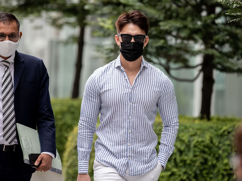 Titus Low Kaide (right) arriving at the State Courts on Feb 17, 2022.