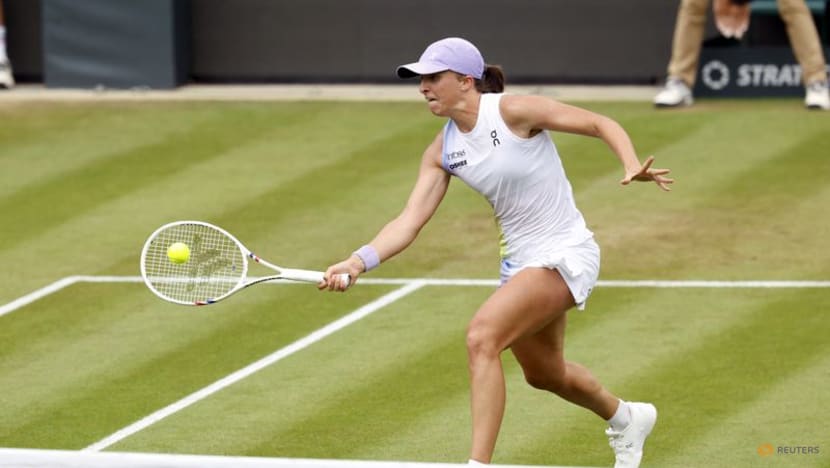 Swiatek cruises past second-seed Paolini to reach first grass final