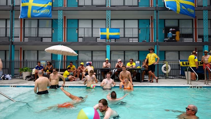 Midsummer madness: Swedish and Dutch fans party before World Cup clash