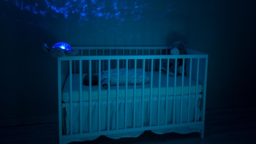Woman charged with dropping 2-month-old baby into cot, fracturing her skull