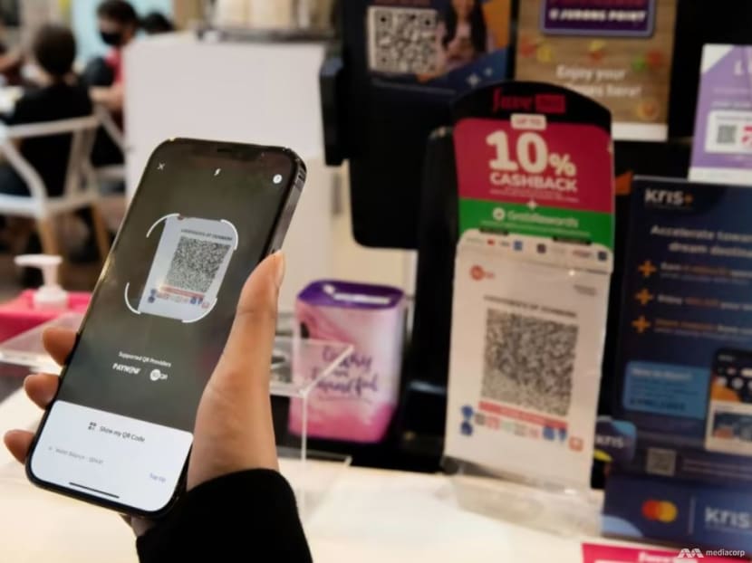 The Big Read: Can Singapore find the right balance as e-payments become the norm? The Big Read: Can Singapore find the right balance as e-payments become the norm?
