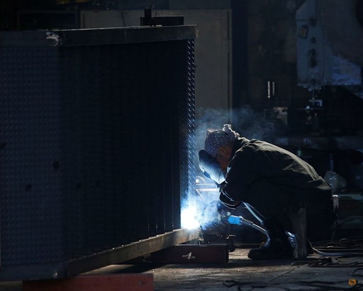 Japan's factory output surges to near 12-year high in July, PMI shows